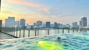 A waterfront view with a city skyline in the background.
