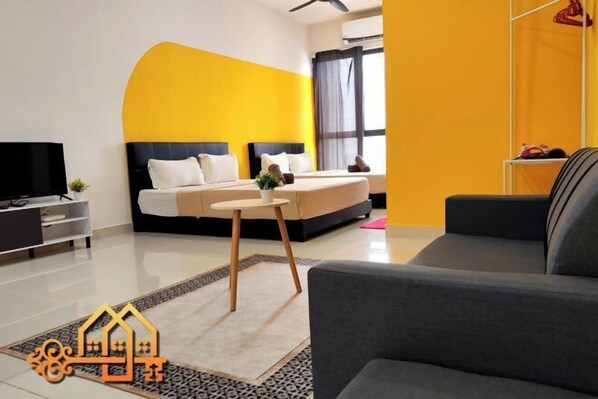 A modern hotel room with a large bed, a TV, and a sofa. - Core Soho Suite KLIA FREE WIFI BY GOLDEN GATES (Dengkil)