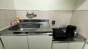 A kitchen with a stainless steel sink, a coffee machine, and a bottle of dish soap. - Nakano5chome-102 (Tokyo)