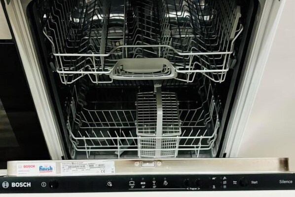 An empty dishwasher with control panel and Bosch branding. - LIRRA LUXE (Belgrade)
