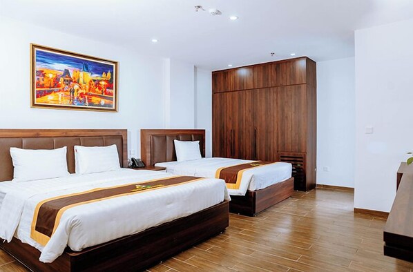 Family Triple Room, City View | Desk, laptop workspace, free WiFi