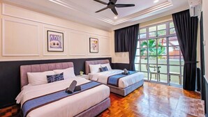 A hotel room with two beds, a ceiling fan, a large window with curtains, and artwork on the walls. - JB Town Villa by RR JBcity (Johor Bahru)