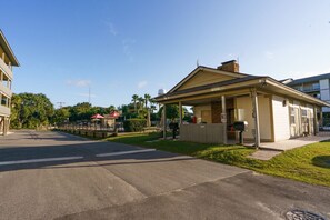 A small, single-story building with a covered porch, a mailbox, and a 'No Parking' sign. - Resort views - Huge Balcony - Steps to the beach! (Tybee Island)