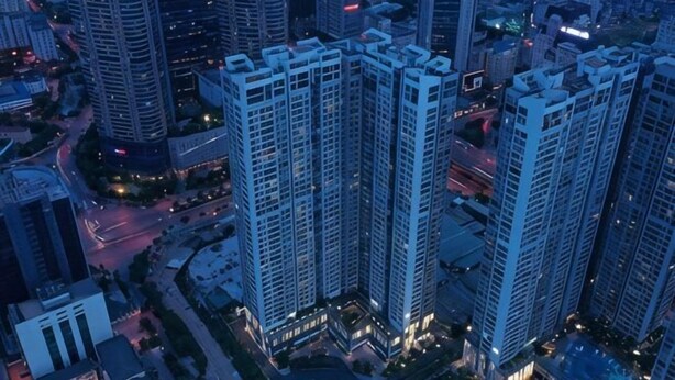A high-rise building complex with multiple floors, surrounded by other tall buildings, and featuring a mix of residential and commercial spaces. - Flora Urban - Premium Apartment Vinhomes Skylake Near Keangnam (Hanoi)