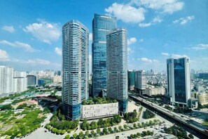 A high-rise building complex with multiple skyscrapers, surrounded by greenery and a clear sky. - Flora Urban - Premium Apartment Vinhomes Skylake Near Keangnam (Hanoi)
