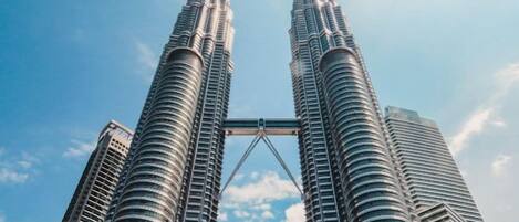 The iconic twin towers of a modern skyscraper with a distinctive architectural design.