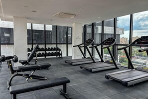 A gym with treadmills, dumbbells, and benches. - Designer Suites George Town + LG Water Purifier【City View】 (Jelutong)