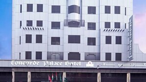 A modern hotel with a symmetrical facade, multiple balconies, and a prominent sign reading "Concorde Palace Hotel". - Concorde Palace Hotel (Dubai)