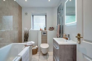 Shower, hair dryer, towels, shampoo