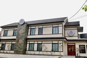 A two-story building with a sign indicating it is a restaurant. - The Ryokan Semarang (Semarang)