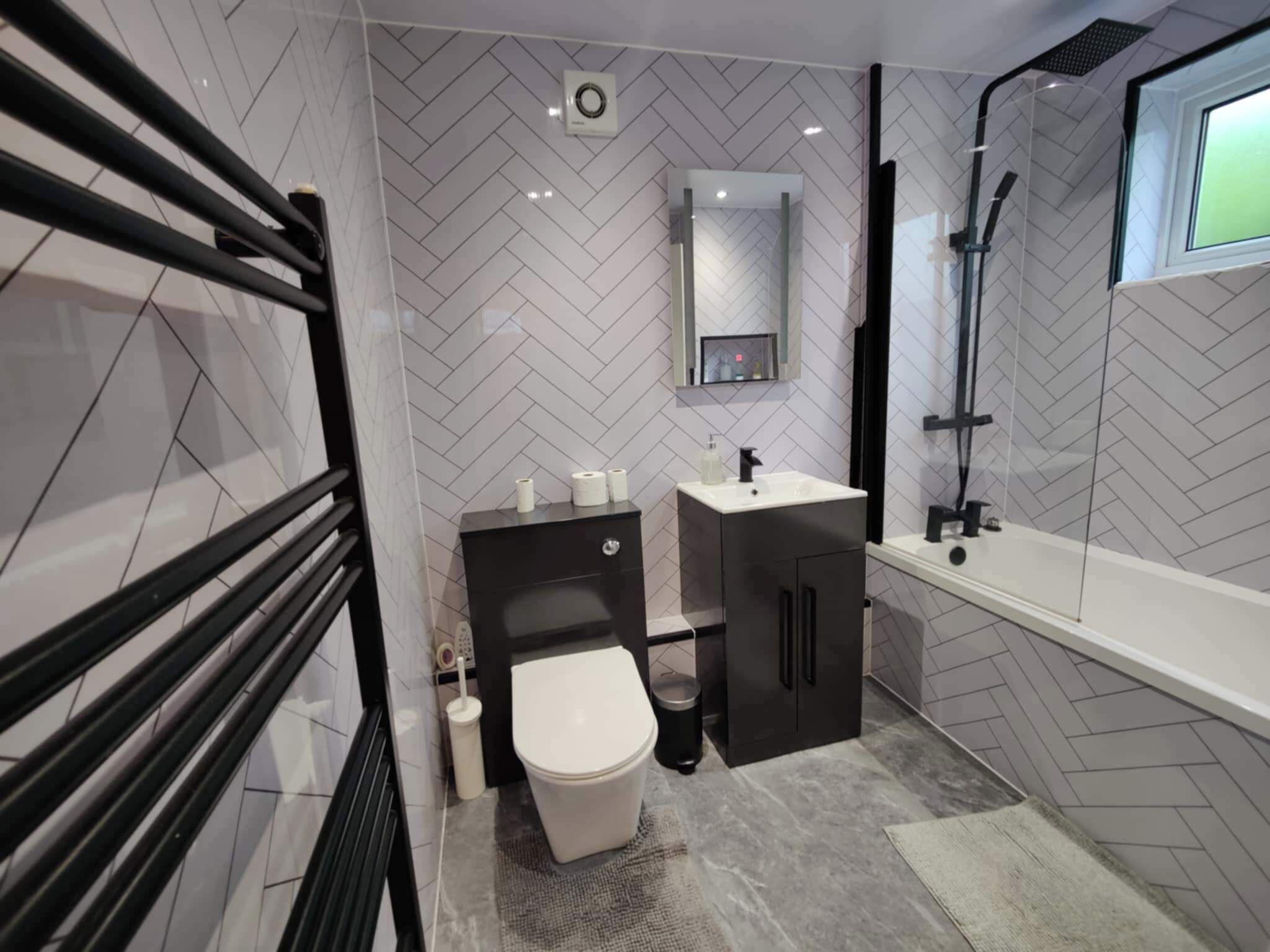 Combined shower/bathtub, deep-soaking bathtub, towels