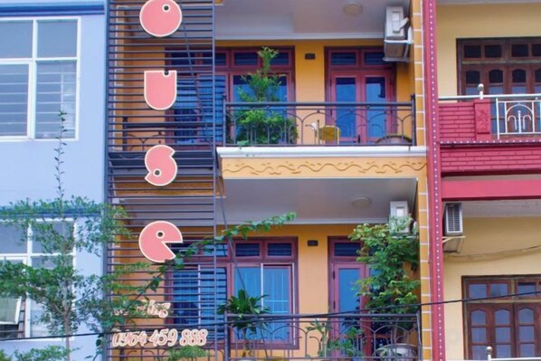 A multi-story building with balconies and windows. - CHI’S HOUSE (P. Hop giang)