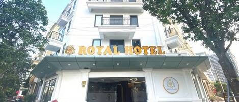 A hotel entrance with a sign reading 'ROYAL HOTEL'.