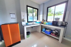 A compact kitchen with a refrigerator, sink, and microwave. - Sweet Hua-Hin Private Pool Villa from beach 3 km (Hua Hin)