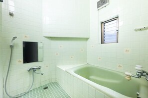A bathroom with a bathtub, a shower, and a window. - 8 min by train from Ikebukuro Station, 18 min from Shinjuku Station (Tokyo)