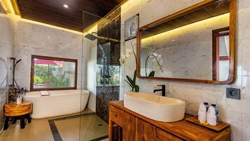Separate bathtub and shower, free toiletries, hair dryer, bathrobes