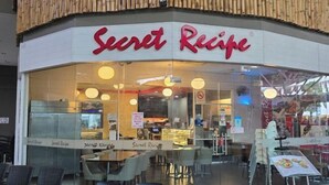 A restaurant named 'Secret Recipe' with a modern interior, glass partitions, and a variety of seating options including tables and chairs. - 2BR@Afiniti(8PAX) 3mins Walk to Legoland (Iskandar Puteri)