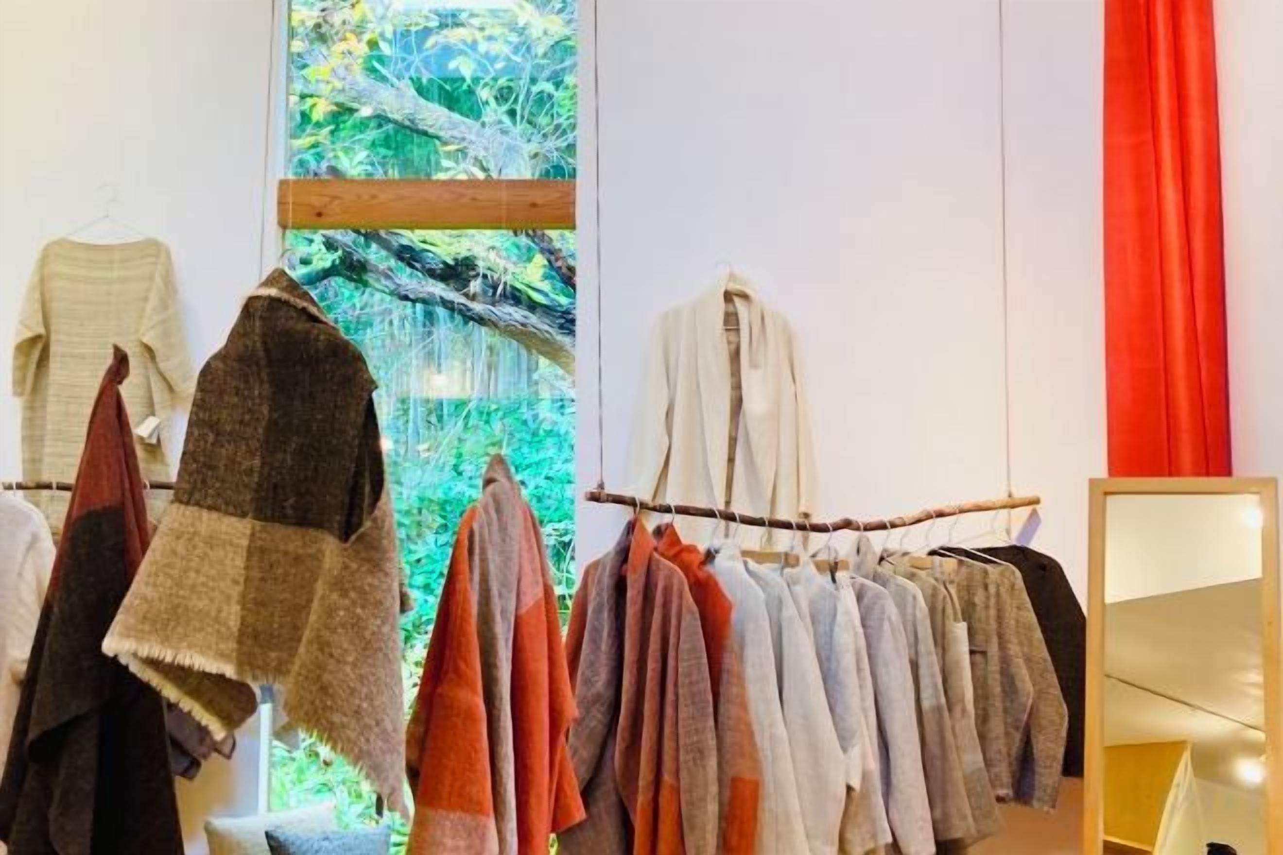 A clothing rack with various garments.