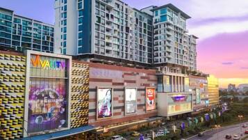 A multi-story hotel with a modern facade, large windows, and a prominent entrance.