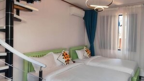 A room with two beds, a staircase, and a modern light fixture. - Vip Kingson Guest House (Luang Prabang)