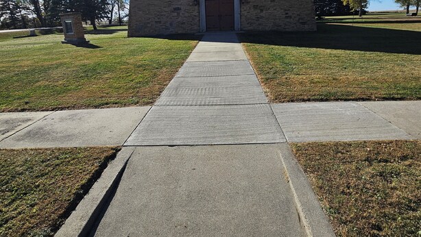 A small brick building with a cross on top, a central entrance, and a cross-shaped pathway leading to it. - unique 3BR lodge w/ basic amenities & two RV's on 1.58 acres in beautiful Oldham (Oldham)