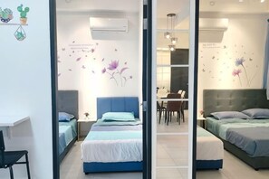 A bedroom with two beds, a desk, and a chair. - Ocean Home@Urban Suites@3BR@10+2 Pax (Jelutong)