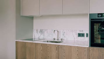 Mini-fridge, oven, cookware/dishes/utensils