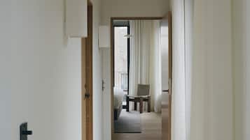 Grand Suite serviced apartment - 2 bathrooms | Living area | 52-inch flat-screen TV with satellite channels, heated floors