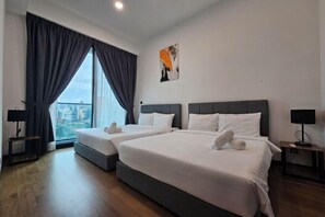 A hotel room with two beds, a large window with curtains, a city view, and a painting on the wall. - Opus Residences by Star Haven (Kuala Lumpur)