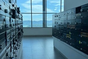 A room with a large window and rows of filing cabinets. - Jesslton quay Dream stay (Kota Kinabalu)
