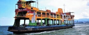 A colorful ferry with multiple decks and a name visible on the side. - 7-Room Exec House, Rumahku Express, Georgetown (George Town)