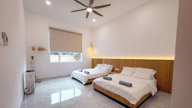 A hotel room with two beds, a ceiling fan, a window with blinds, and a marble floor. - Aesthetic Muji Pool Villa in Ipoh 5BR 24Pax (Tambun)