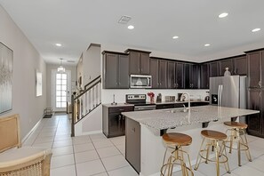 Villa | Private kitchen | Highchair, dining tables