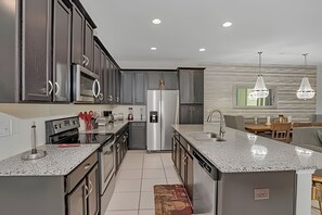 Villa | Private kitchen | Highchair, dining tables