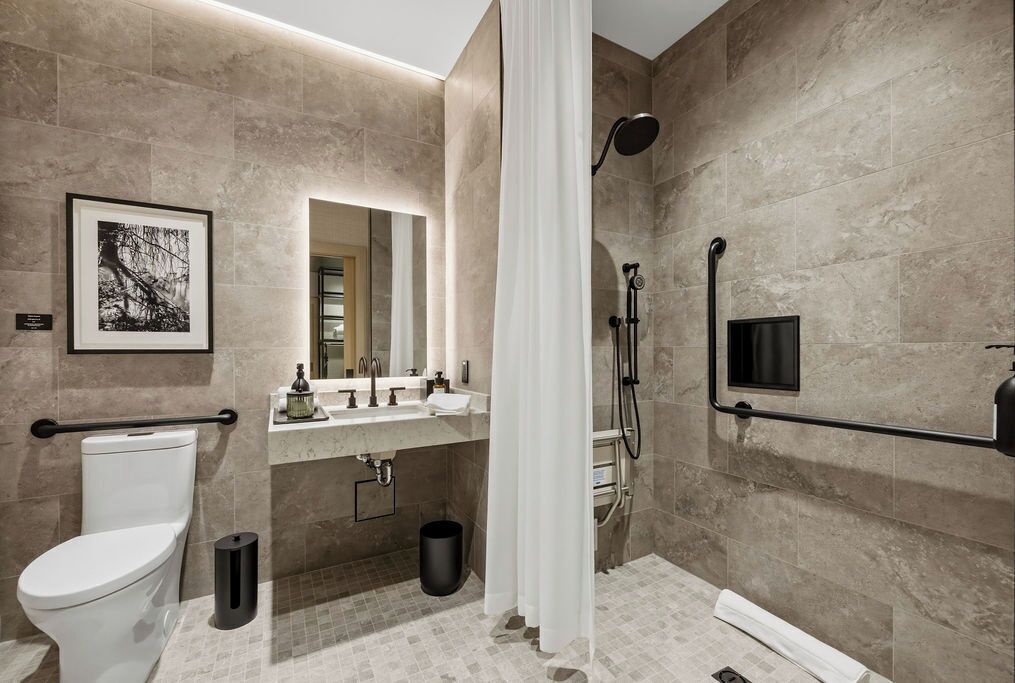 Deluxe Room, Multiple Beds, Roll-in Shower, Non Smoking | Bathroom | Shower, hair dryer, towels, soap