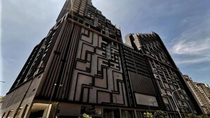 A high-rise building with a modern architectural design, featuring a geometric facade and multiple balconies. - Thermospace Imperio A-27-07 Melaka City (Melaka)