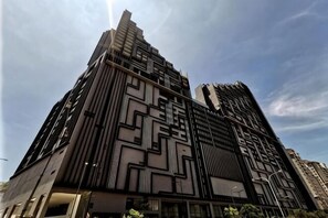 A high-rise building with a modern architectural design, featuring a geometric facade and multiple balconies. - Thermospace Imperio A-27-07 Melaka City (Melaka)