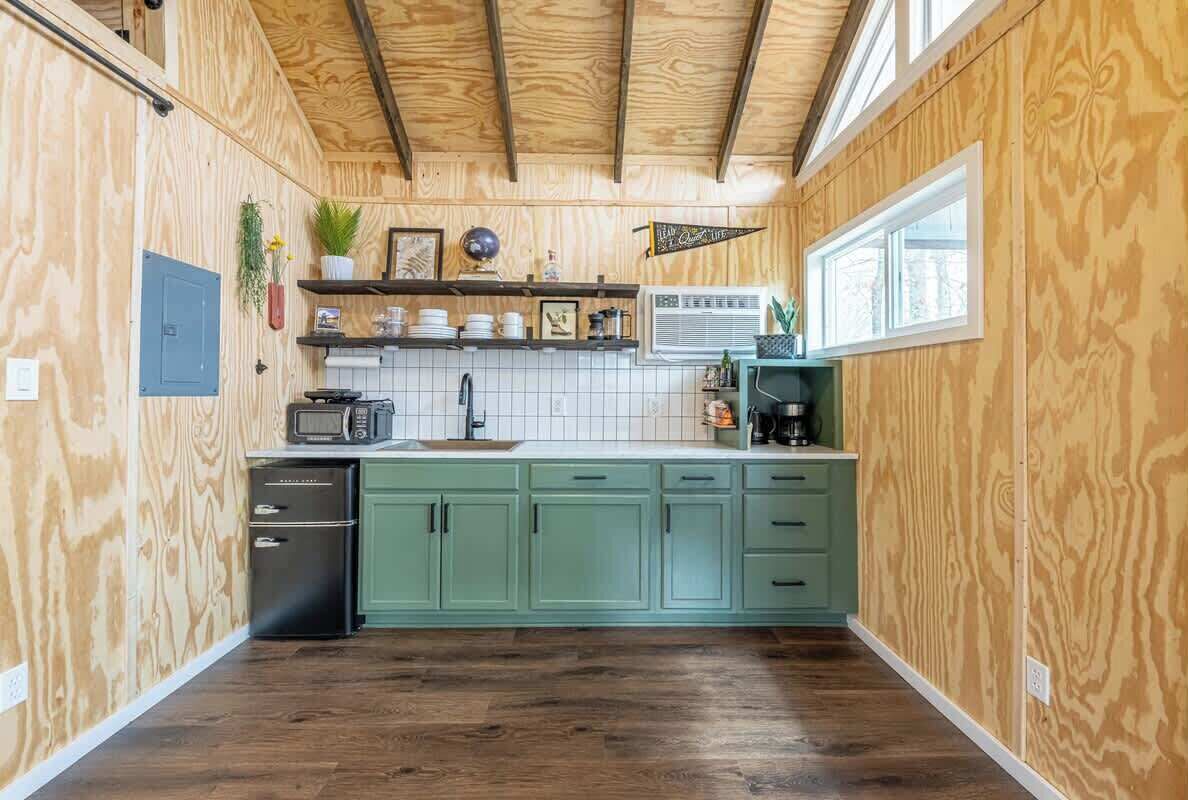 Fridge, microwave, coffee/tea maker, cookware/dishes/utensils