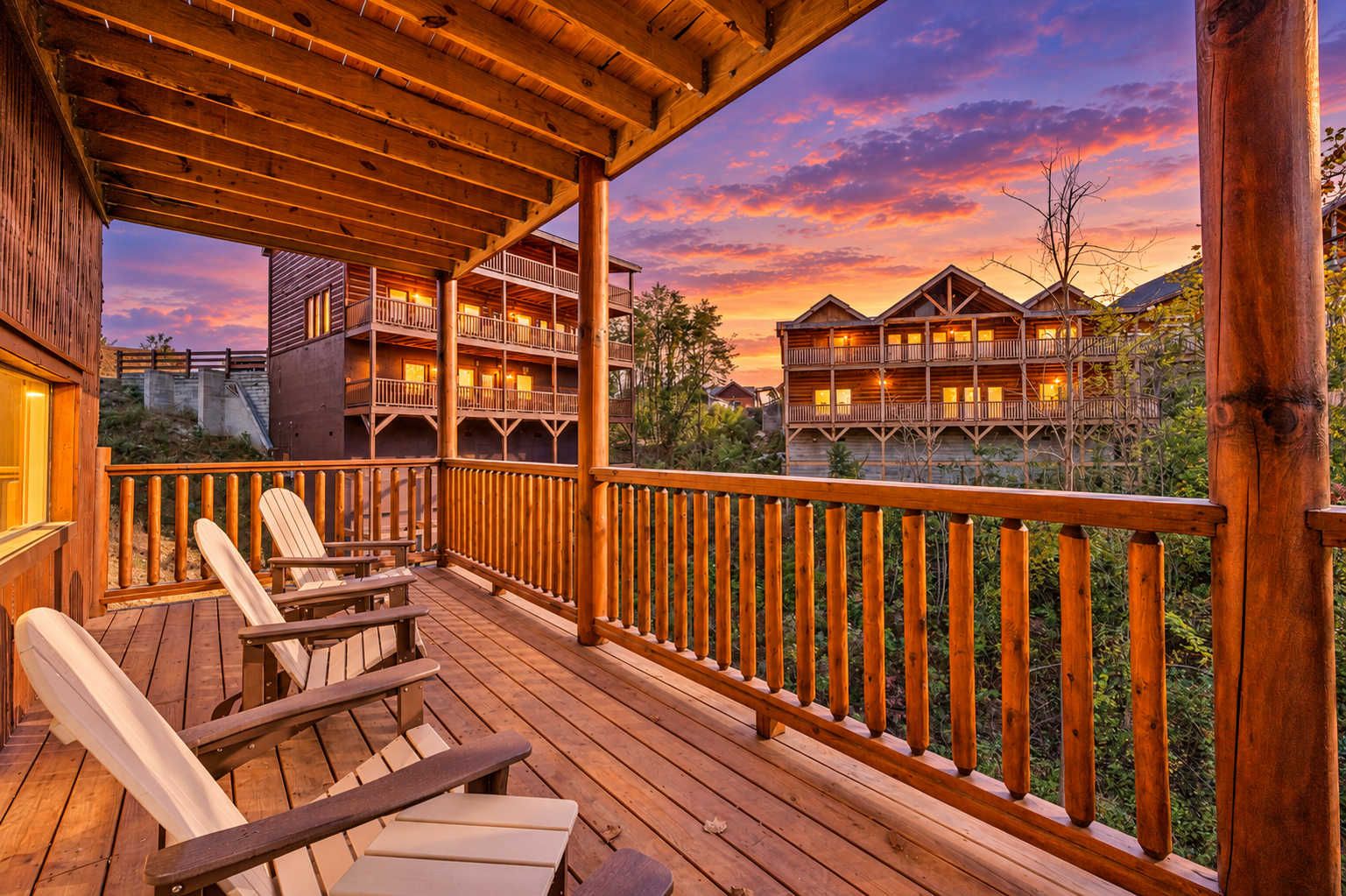 A wooden deck with outdoor seating and a view of a multi-story building with balconies.