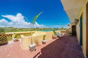 Deluxe Double Room, 1 Queen Bed, Balcony, Partial Sea View | View from room - The Swahili Plaza (Matemwe)