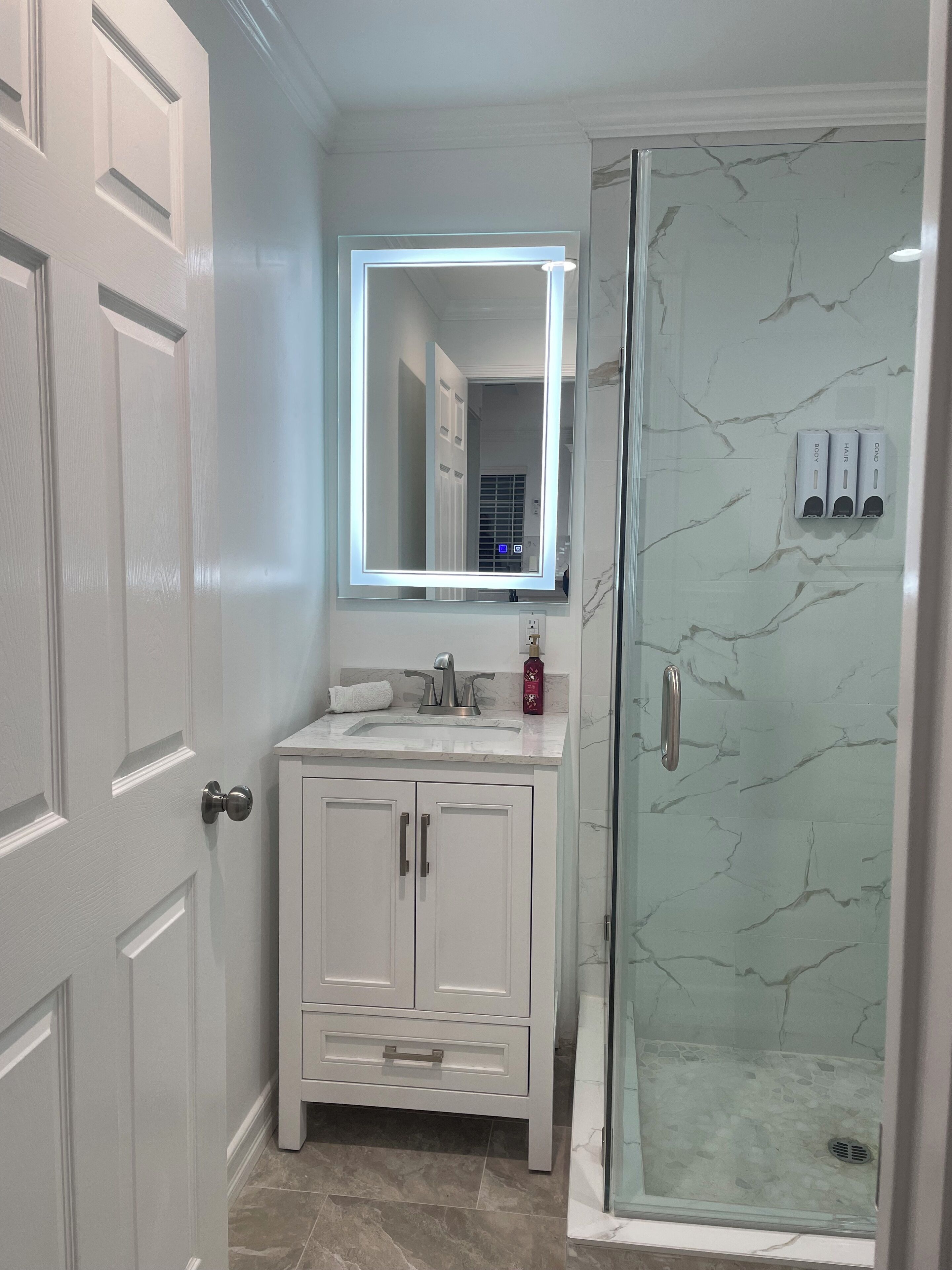 Shower, hair dryer, towels, soap