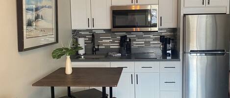 Fridge, microwave, stovetop, coffee/tea maker