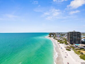 A coastal hotel with a beach view, multiple floors, and a pool area. - Private Beach Micro-Resort >1 mile to the beach  [ALL 4 Units] sleeps 18 (St. Pete Beach)