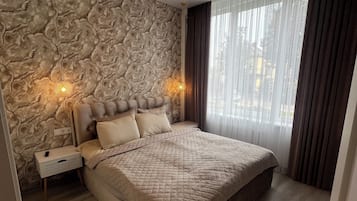 Appartement Familial, vue jardin | Rideaux occultants, fer et planche Ă repasser