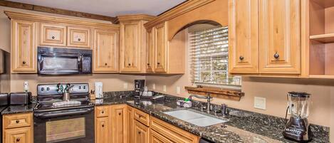 Fridge, microwave, stovetop, cookware/dishes/utensils