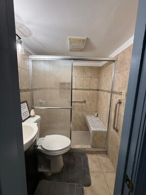 Shower, hair dryer, towels, toilet paper