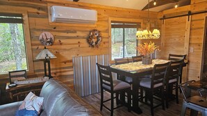 A cozy cabin interior with a dining table, chairs, a sofa, and a fireplace. - Mountain cabin, gorgeous views! 15 Min to 2 Whitewater Rafting Rivers! feed deer (Murphy)