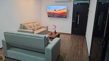 Superior Double or Twin Room, Mountain View | Living area | 55-inch flat-screen TV with cable channels