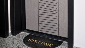 A modern door with horizontal lines, a keyhole, and a lock. - New Modern 1 bedroom with private parking (Varna)