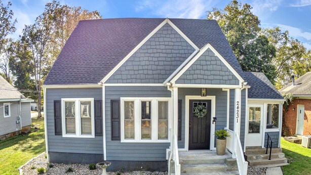 A two-story house with a dark gray exterior, white trim, and a dark roof. - Blueberry Cottage - Downtown Park City (Park City)